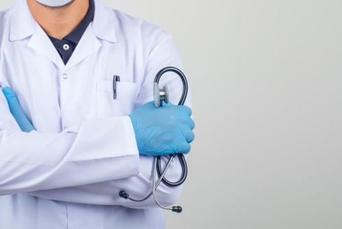 doctor-crossing-arms-while-holding-stethoscope-in-white-coat (1)